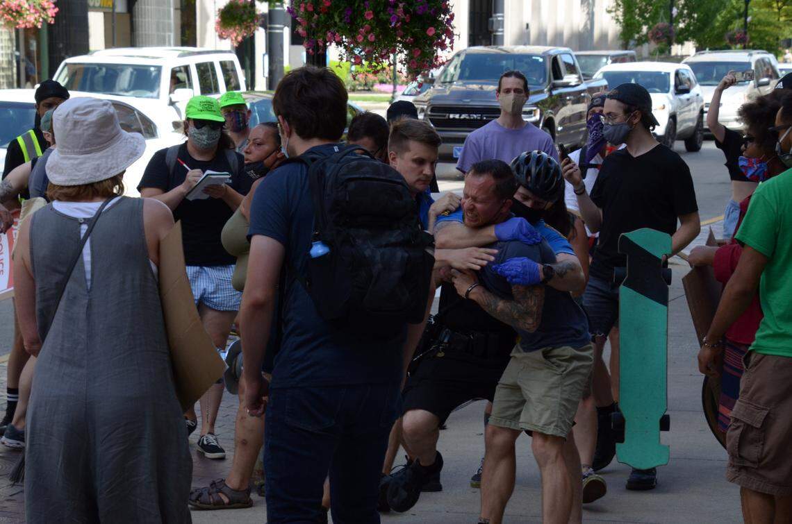 After saying that a member of their group was put in a choke hold, protesters released images of the arrest.