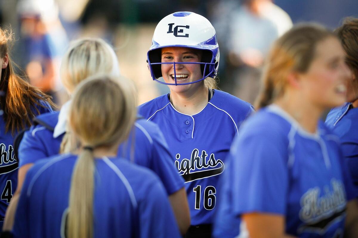 Lexington Catholic’s Sara Prisinzano (16) celebrated with teammates after hitting a home run against Lafayette on Thursday. The Knights won 3-0.