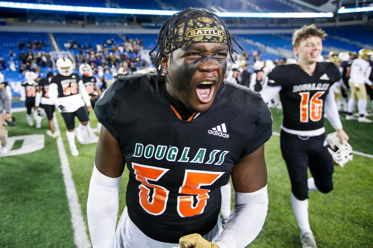 Frederick Douglass’s Steve Lawson celebrates after the Broncos defeating Bowling Green 28-7 during the Class 5A UK HealthCare Sports Medicine State Football Championship at Kroger Field in Lexington, Ky., Saturday, December 2, 2022.
