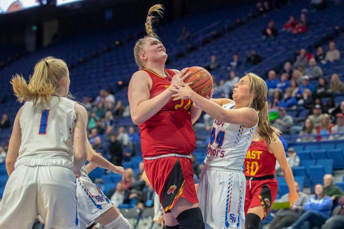 Bullitt East’s Gracie Merkle (24) shoots the ball as Southwestern’s Taylor Nelson (44) plays defense during the semifinals of the 2022 Mingua Beef Jerky Girls’ Basketball Sweet 16 at Rupp Arena in Lexington, Ky., on Saturday, March 12, 2022.