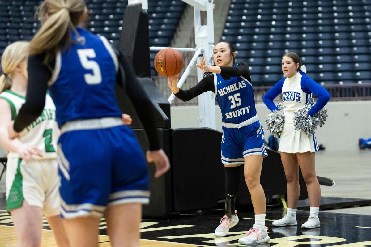 Nicholas County senior Katie Switzer (35) plays four varsity sports for the Lady Jackets: basketball, golf, tennis and volleyball.