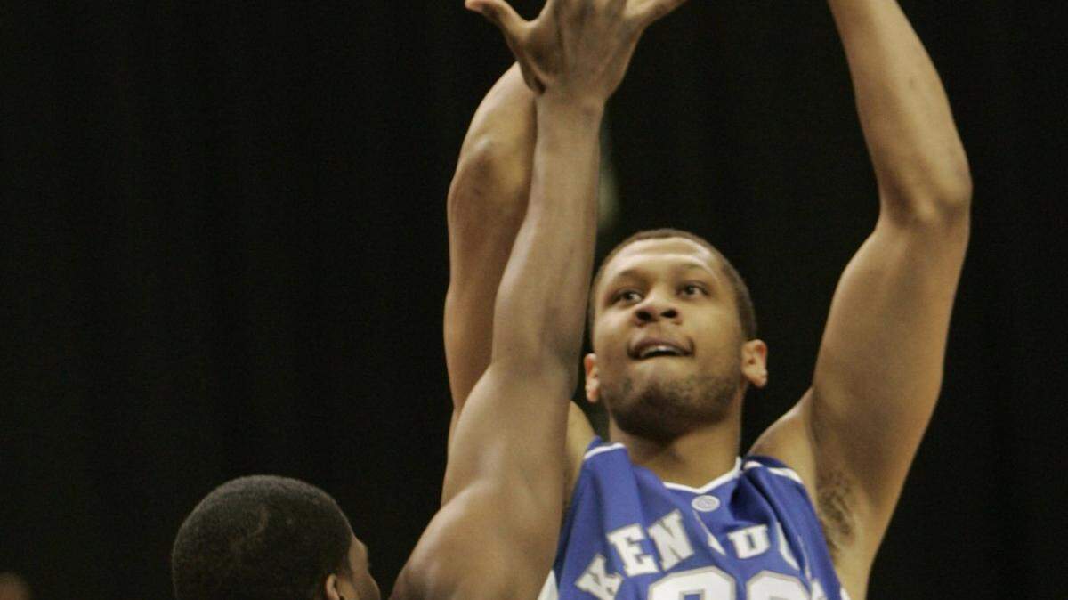 UK’s Randolph Morris shot over Mississippi State’s Charles Rhodes in the first half during the second round of the Men’s SEC Basketball Tournament in the Georgia Dome in Atlanta, Ga., on March 9, 2007. David Stephenson/Staff 2543