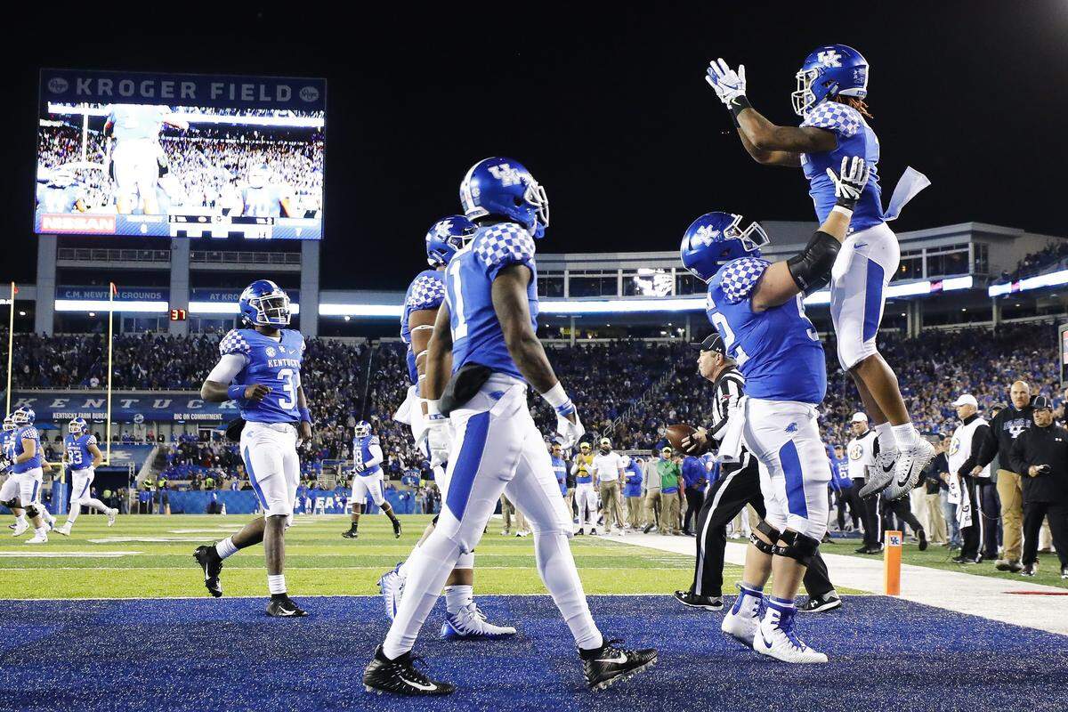 Kentucky slot receiver Lynn Bowden was hoisted into the air in celebration by center Drake Jackson (52) after catching a touchdown pass in the first half of UK’s 14-7 victory over Vanderbilt.