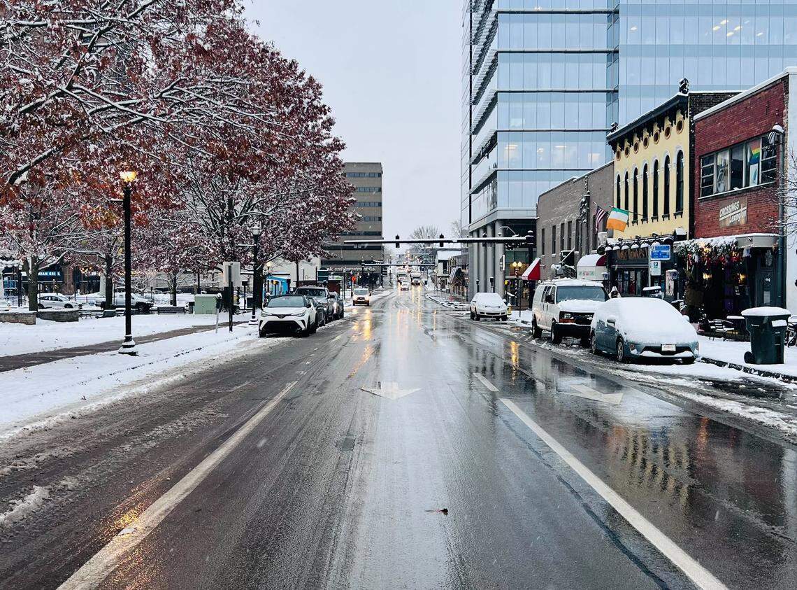 Cars on North Limestone are covered in snow after an overnight storm dropped a few inches of snow in Lexington, Ky. on Dec. 12, 2025.