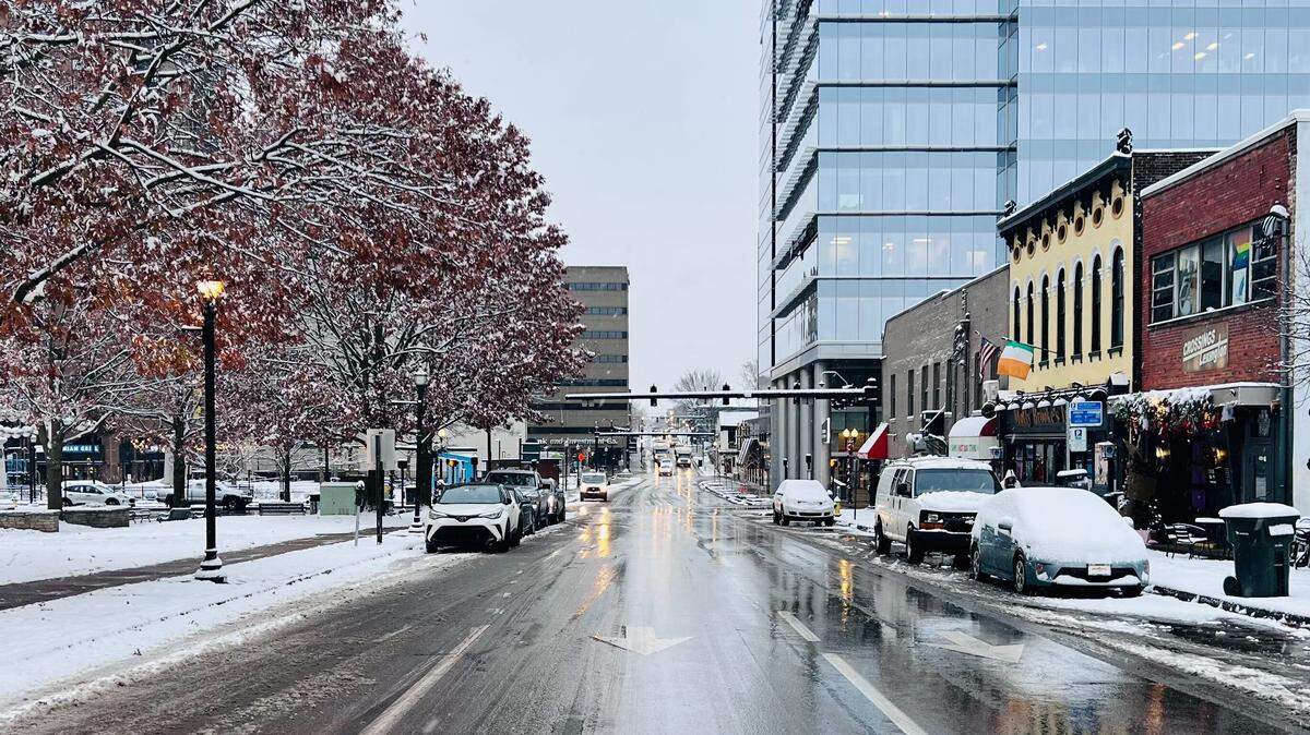 Cars on North Limestone are covered in snow after an overnight storm dropped a few inches of snow in Lexington Dec. 12, 2025.