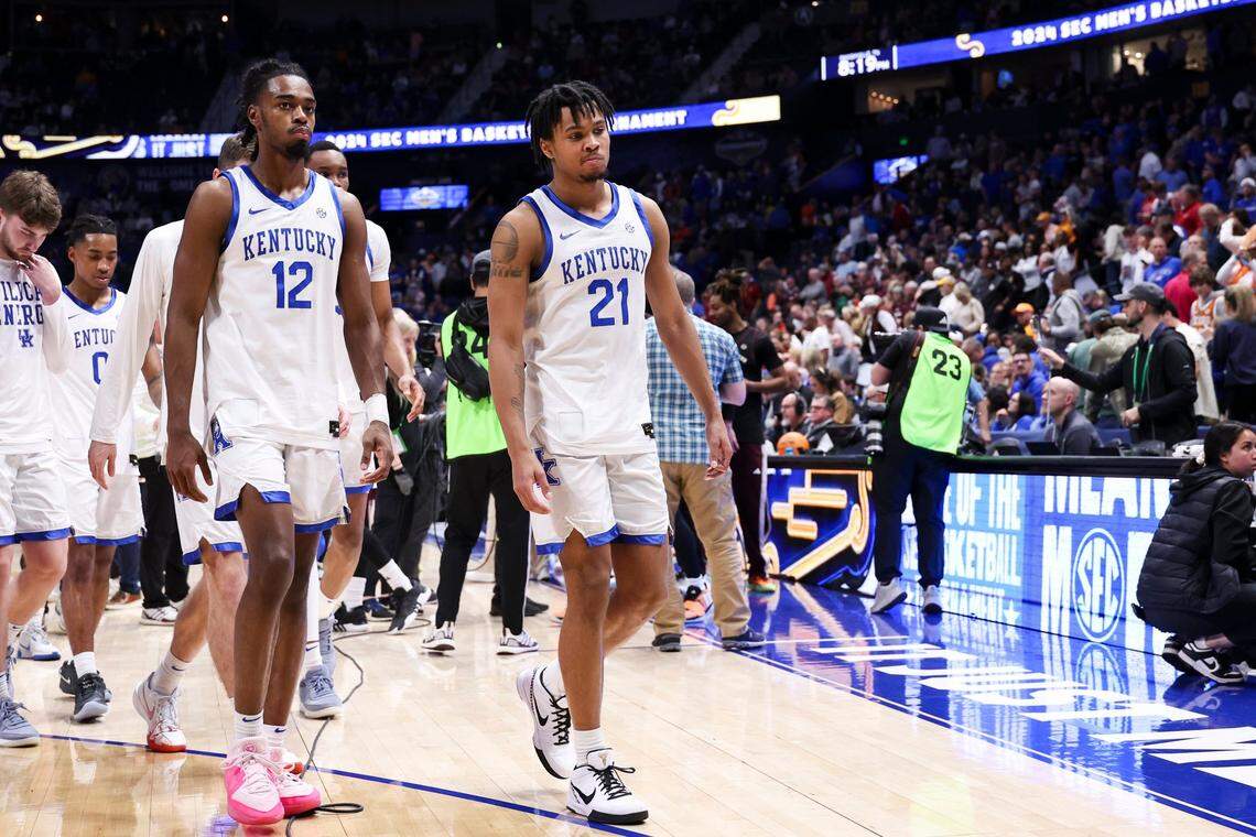 Kentucky guards Antonio Reeves (12) and D.J. Wagner (21) leave the court after their team’s loss to Texas A&M in the SEC Tournament quarterfinals at Bridgestone Arena in Nashville.