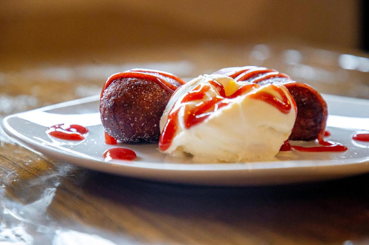 For desert, Mami Monchita’s offers empanadas de platano, which are two fried empanadas made with plantain dough filled with vanilla custard served with vanilla ice cream a strawberry marmalade drizzle.