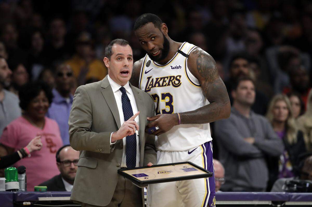 Los Angeles Lakers head coach Frank Vogel, left, talked with LeBron James during the second half of an NBA basketball game against the Boston Celtics last season. Vogel is a former University of Kentucky men’s basketball manager and JV basketball player.