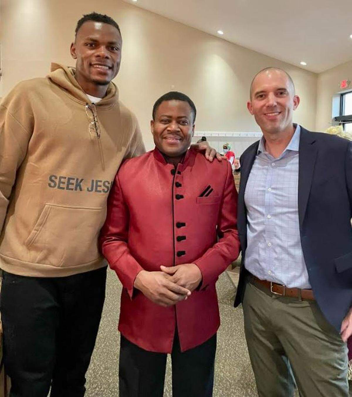 Kentucky basketball player Oscar Tshiebwe, left, with Broadway Baptist Church African pastor Raphael Jumbuin, center, and Broadway Baptist Church pastor Daniel Ausbun.