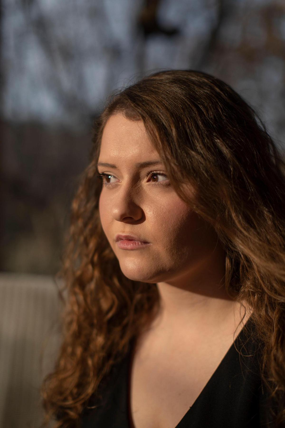 Shelby Ponder poses for a portrait outside her home in Mount Vernon, Ky, Tuesday, March 9, 2021. Ponder experienced serious, long-term side effects from Covid-19. After she was exposed to the virus Ponder experienced a fever that lasted close to three weeks. When her fever dissipated she had extreme difficulty sleeping and was eventually diagnosed with swelling in her brain, or encephalitis. ”It was horrifying,” Ponder said. This caused her to have problems with her vision, migraines, motor skills and memory. “You never think something like that could be wrong with you,” Ponder said.