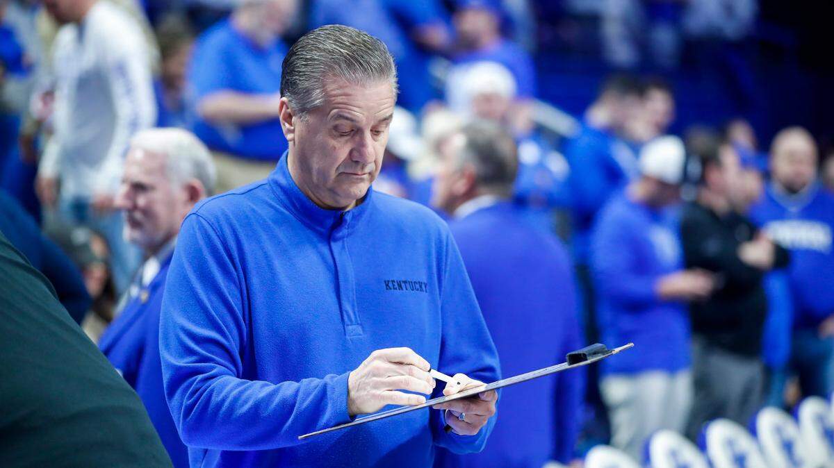 Kentucky head coach John Calipari looks at his clipboard before the game against the Arkansas Razorbacks in Rupp Arena on Tuesday.