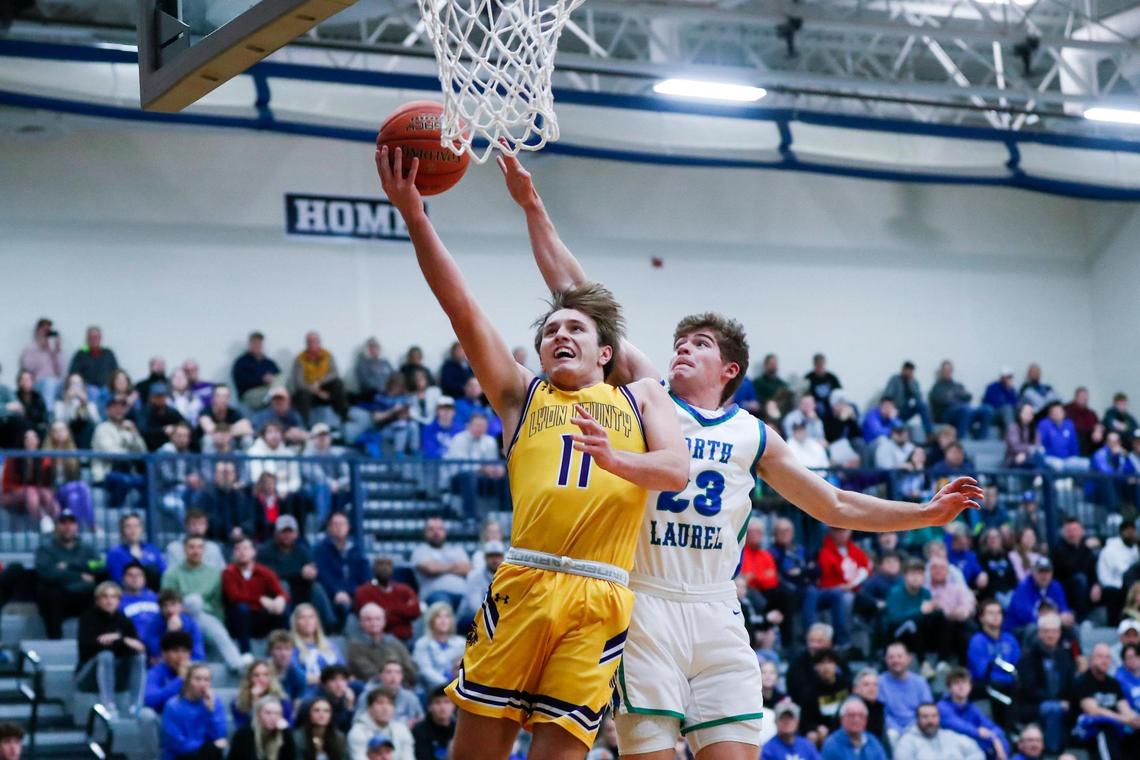 Lyon County’s Travis Perry (11) drives to the basket against North Laurel’s Brody Brock during Saturday night’s Second Chance Shootout at Lexington Catholic.