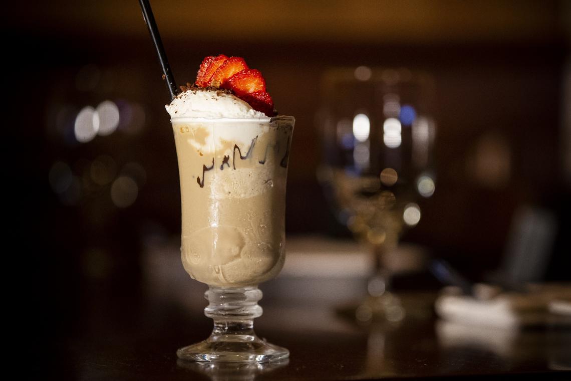 A coffee ice cream milkshake with whipped cream, chocolate syrup and strawberries is one of the desserts served at The Tulip Bar & Bistro in Lexington.