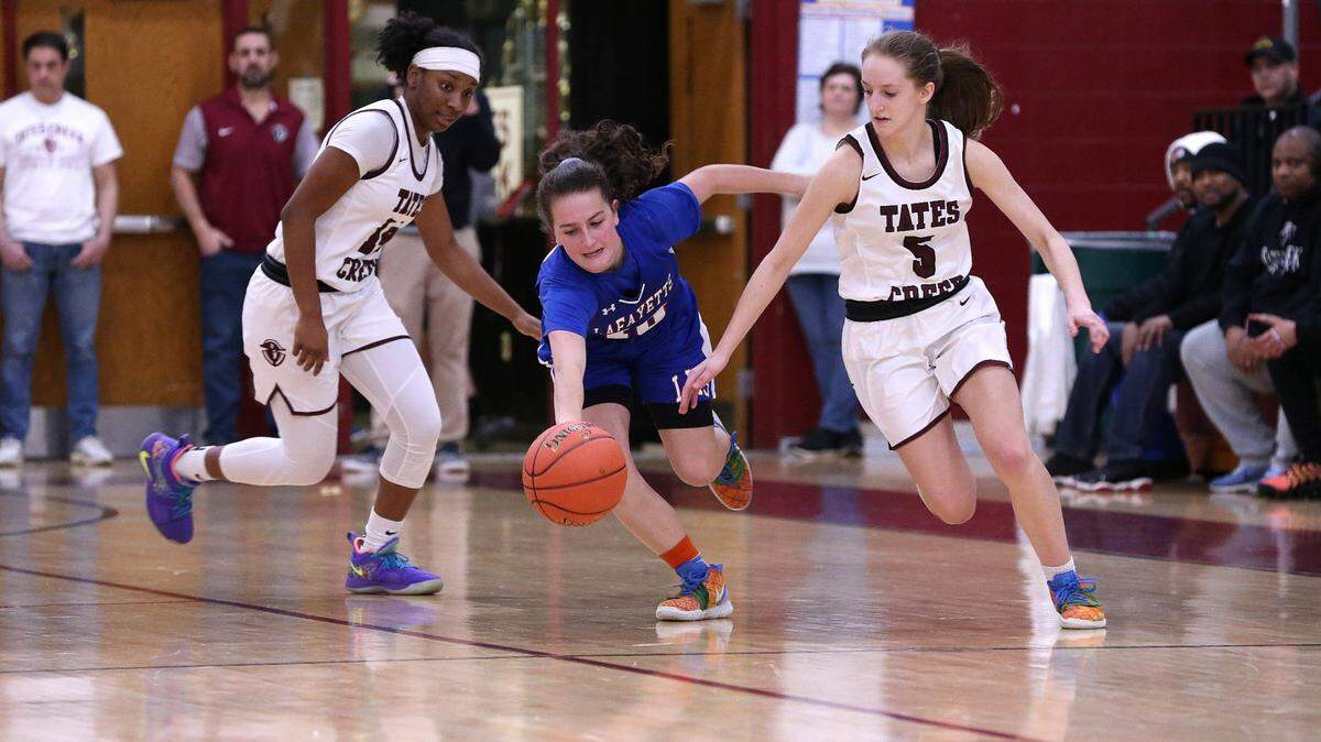 Tates Creek’s Maddie Kauffman went after a loose ball ball after she tipped it away from Lafayette’s Catherine Jacobs during a game last season.
