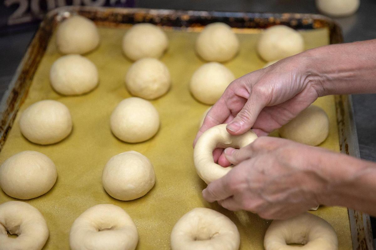 Baker Rhonda Patton forms bagels June 9 at Native Bagel. The Berea shop forms all their bagels by hand.