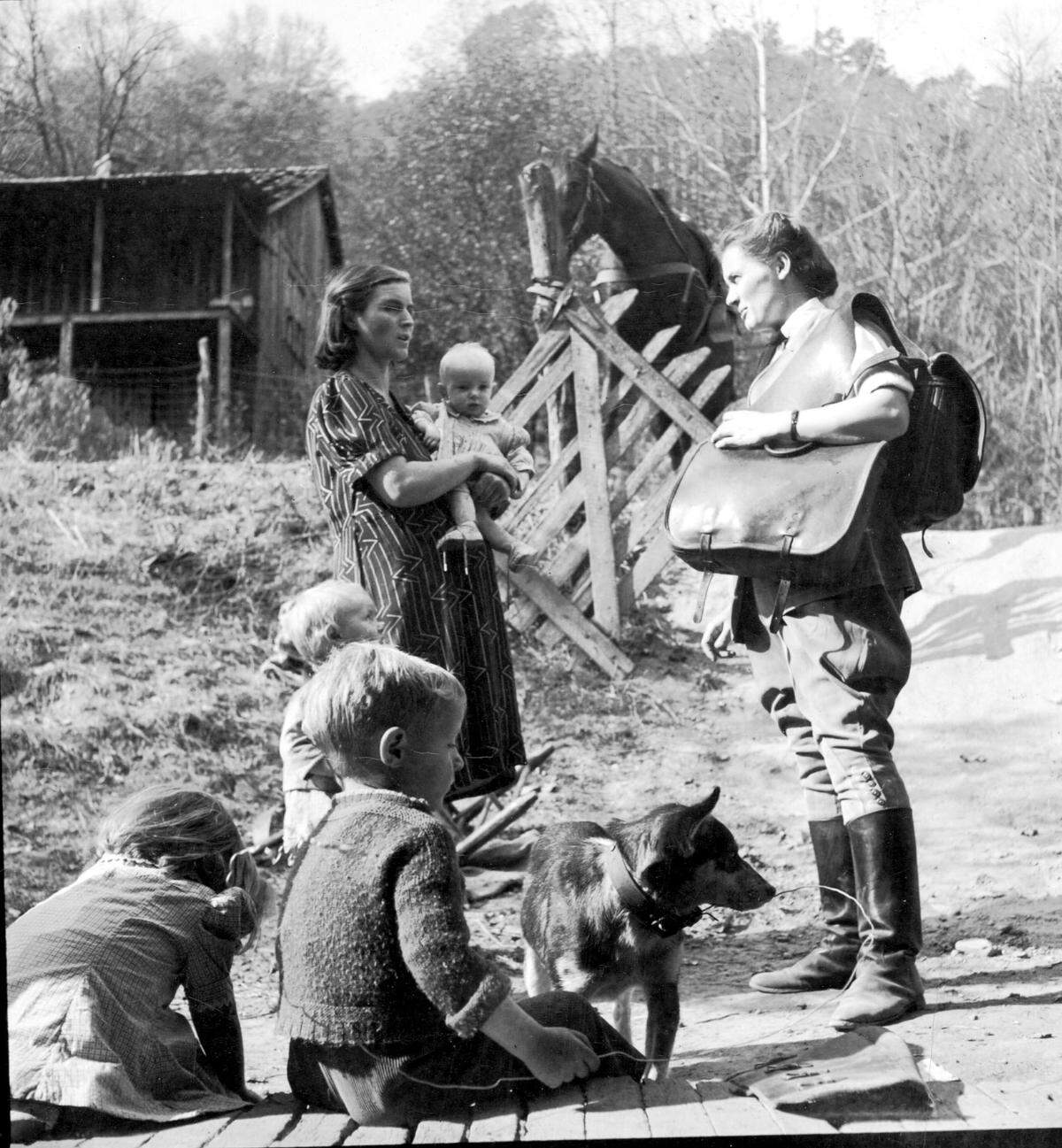A Frontier Nursing Service nurse visited a family in the 1930s. When Mary Breckinridge started the rural health care program in Leslie and Clay counties in 1925, the area had few roads, so nurses rode horses.