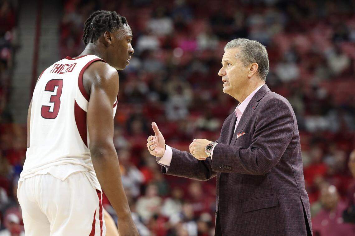 Nov 22, 2024; Fayetteville, Arkansas, USA; Arkansas Razorbacks head coach John Calipari talks to forward Adou Thiero (3) during the second half against the Little Rock Trojans at Bud Walton Arena. Arkansas won 79-67. Mandatory Credit: Nelson Chenault-Imagn Images