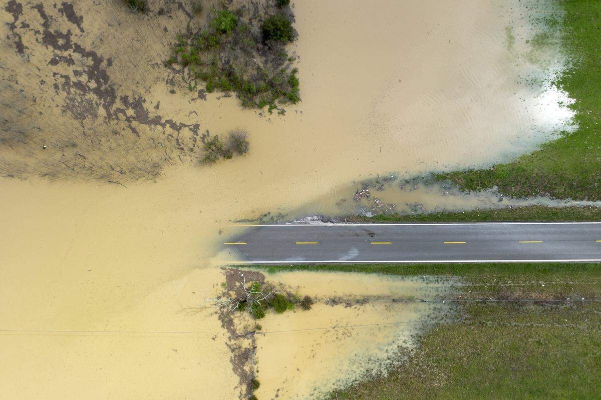 Water floods Kentucky Route 39 near Crab Orchard in Lincoln County, Ky., on Friday, April 4, 2025.