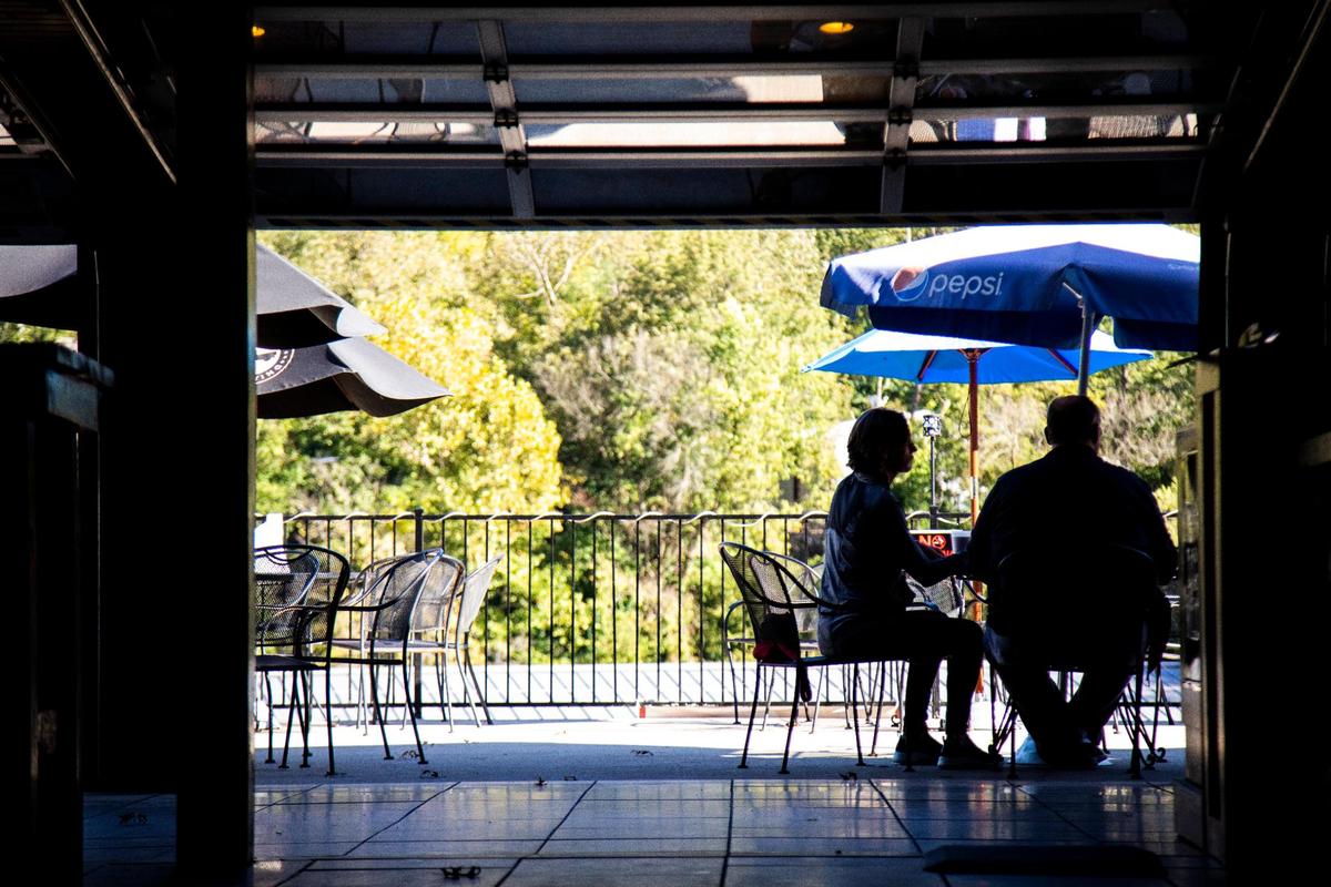 Customers enjoy food Sept. 30 on the patio of Proud Mary BBQ in Lexington.
