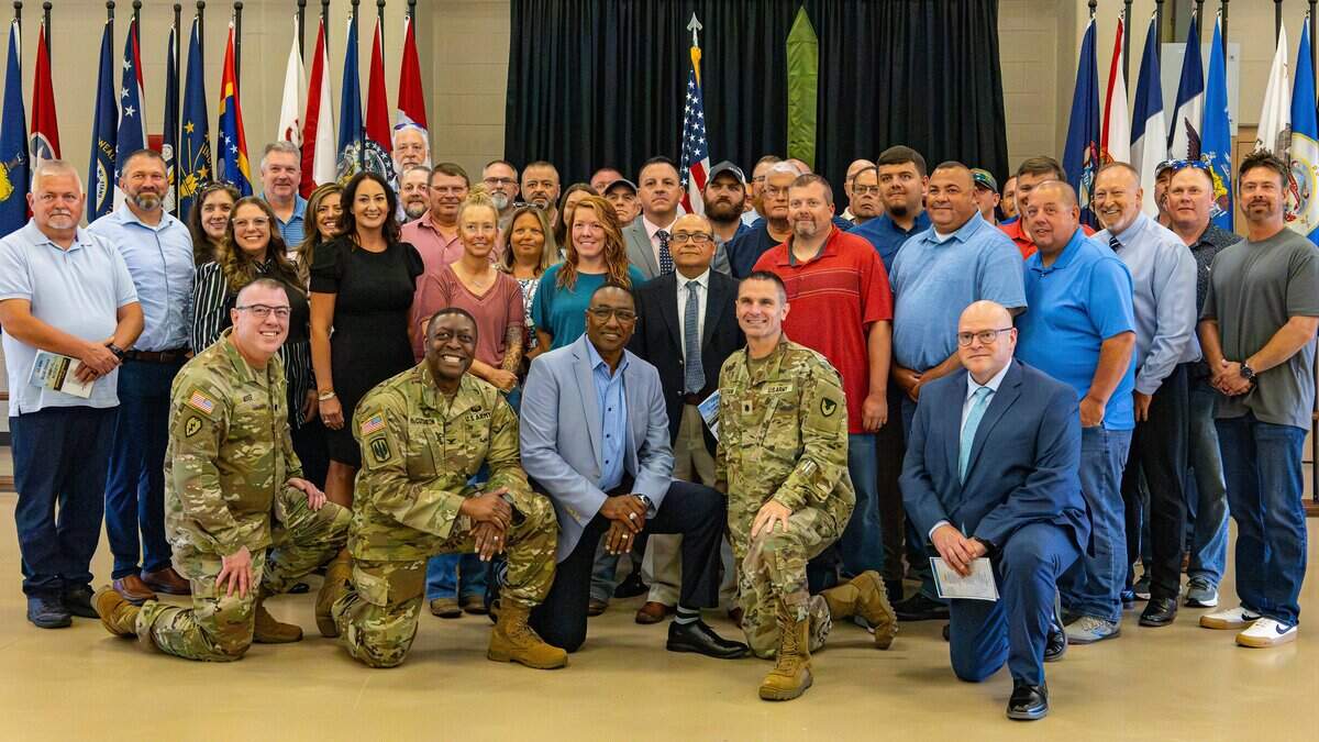 In celebration of their team successfully deactivating and destroying over 500 tons of stockpiled chemical nerve agents and propellant rockets, military personnel stood with civilian contractors for a group photo during the deactivation ceremony of the Blue Grass Chemical Activity located on the Army Reserve Forces Center installation in Richmond, Ky., on June 24, 2026.