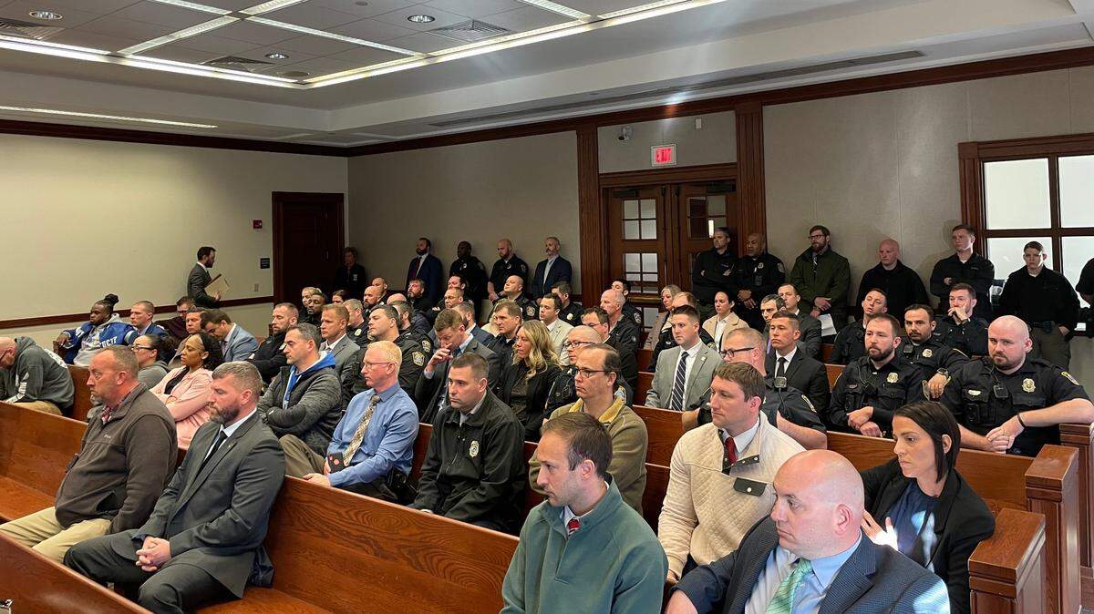 Officers and detectives with the Lexington Police Department fill the courtroom gallery on March 18, 2024, during a preliminary hearing against three men charged with shooting an officer.