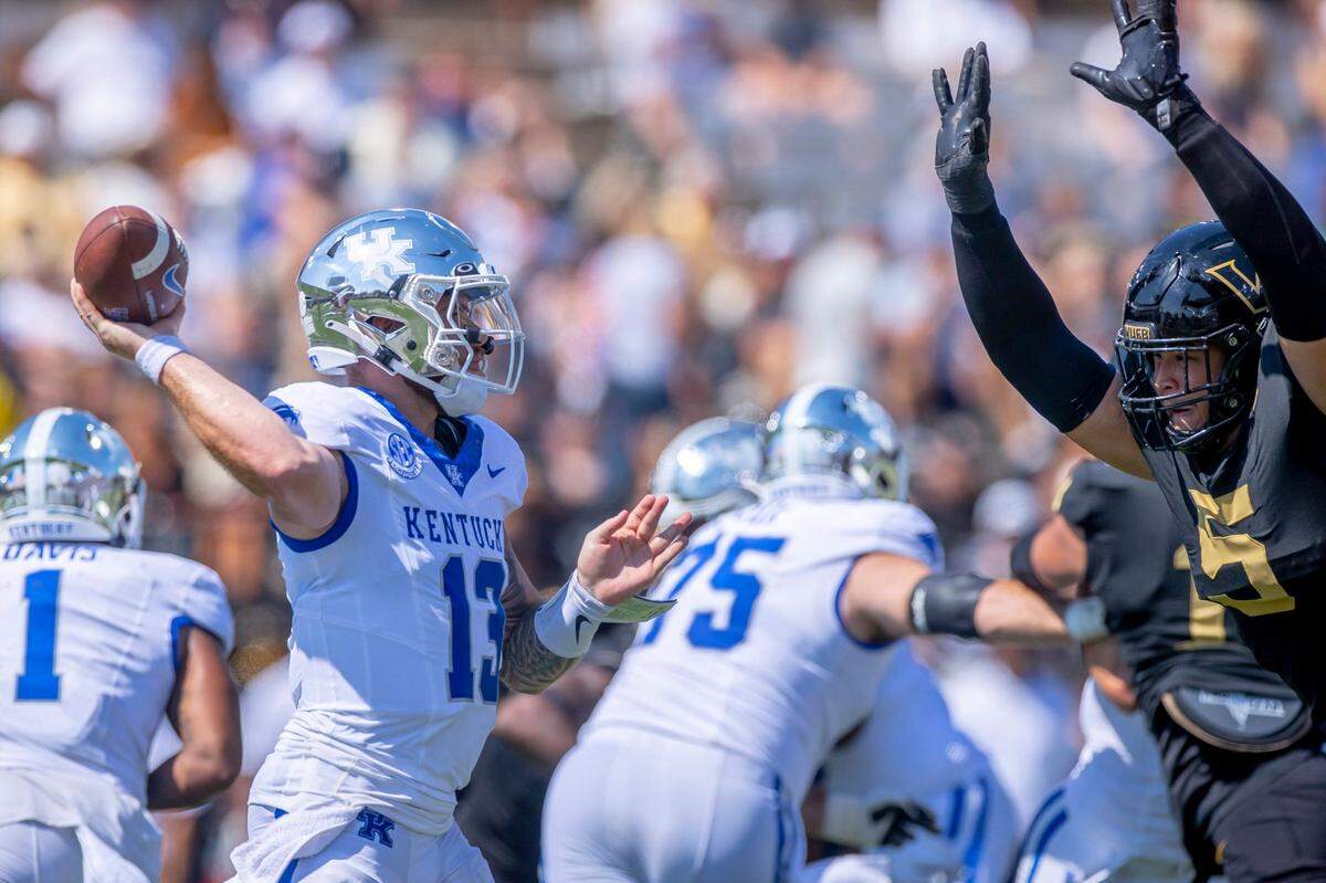 Vanderbilt defensive lineman Yilanan Ouattara (5) pressures Kentucky quarterback Devin Leary (13) at FirstBank Stadium in Nashville on Saturday.