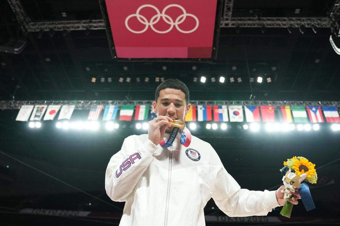 Devin Booker, left, is part of an elite group of Kentucky men’s basketball alums who have won a gold medal at an Olympics while representing the United States.