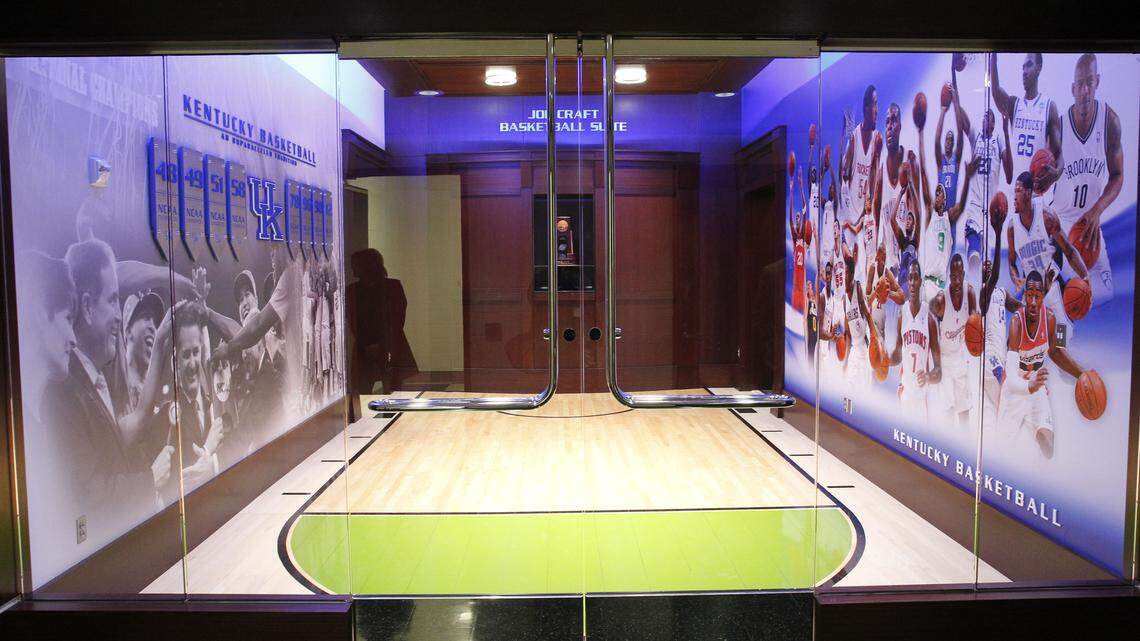 Photo illustrations featuring Coach John Calipari and previous team members cover the walls along the main entrance of the new UK men's locker room complex. The complex is named in honor of UK basketball booster Joe Craft, a coal executive who donated funds for the project.