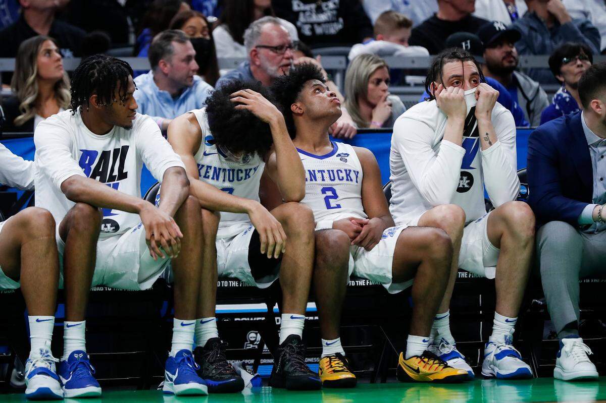 Kentucky’s Jacob Toppin, head down, Sahvir Wheeler (2) and Lance Ware react on the bench during the team’s NCAA Tournament loss to St. Peter’s on March 17.