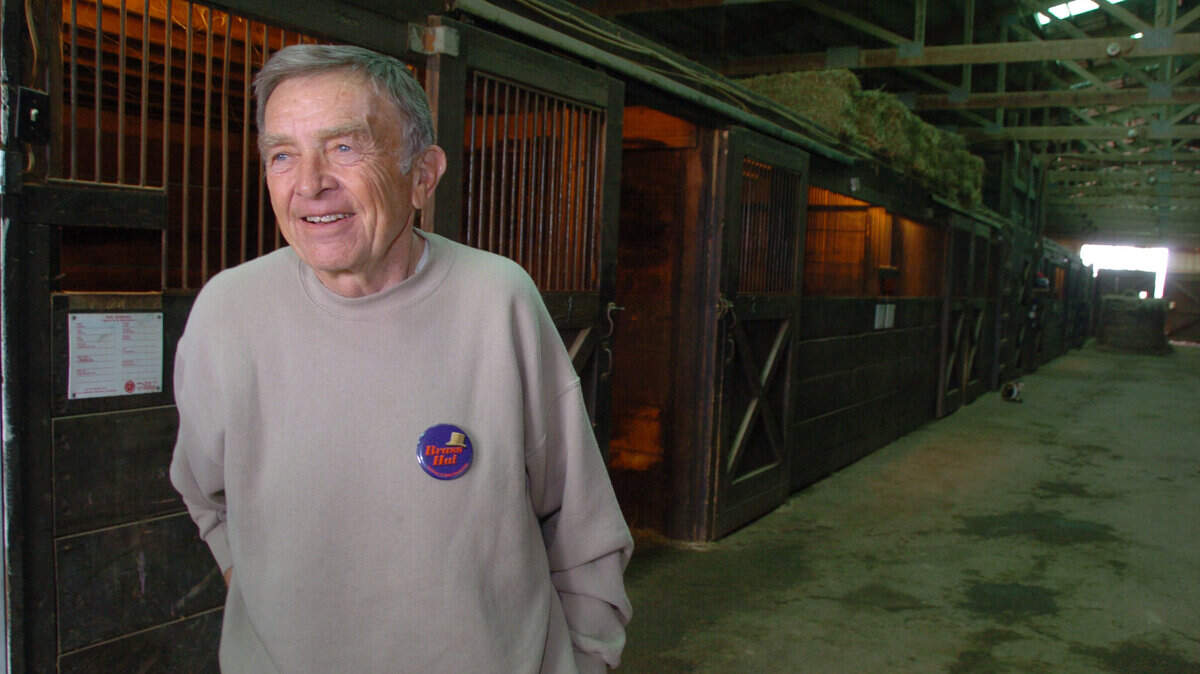 Fred Bradley stands outside the stall (background left) where Brass Hat was born on Thursday, March 9, 2006 at Indian Ridge Farm (owned by the Bradley's) in Franklin County, Ky.   Fred Bradley and his horse-trainer son, Buff Bradley, have entered their home-bred horse, Brass Hat, in the March 25 Dubai World Cup.  (Buff and his wife and kids live on the farm. Fred lives in Florida but visits often.)  Note: Brass Hat was NOT at the farm.-dp
David Perry/Staff

