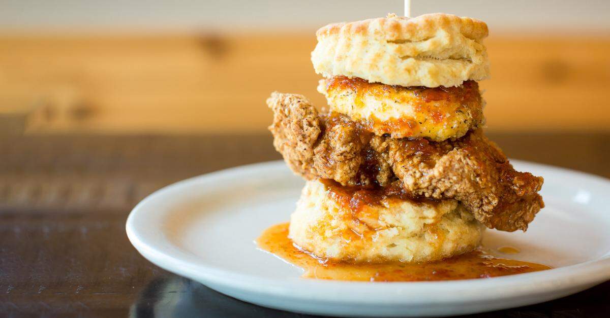 The Squawking Goat, a flaky biscuit with all-natural fried chicken breast, fried goat cheese medallion and house-made pepper jelly is on the menu at Maple Street Biscuit Co.