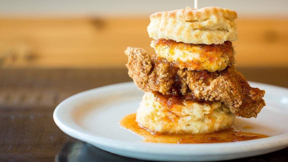 The Squawking Goat, a flaky biscuit with all-natural fried chicken breast, fried goat cheese medallion and house-made pepper jelly is on the menu at Maple Street Biscuit Co.