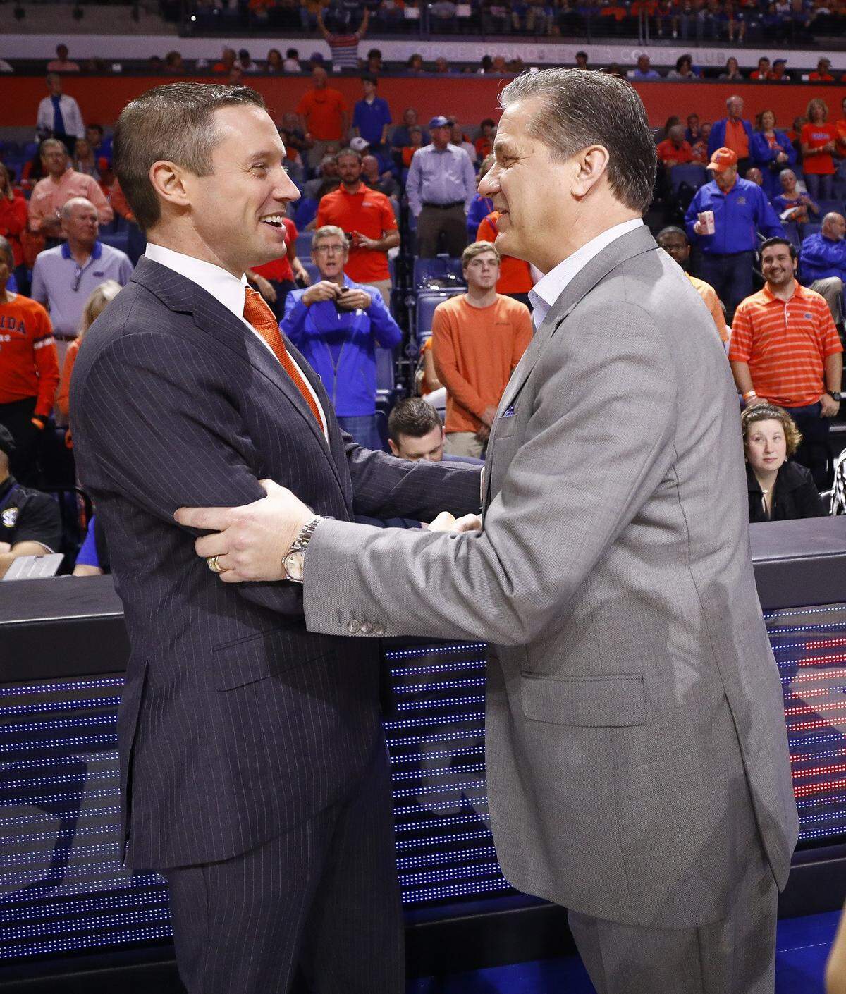 Florida Coach Mike White, left, has directed the Gators to four wins in 12 games against Kentucky and UK Coach John Calipari, right.