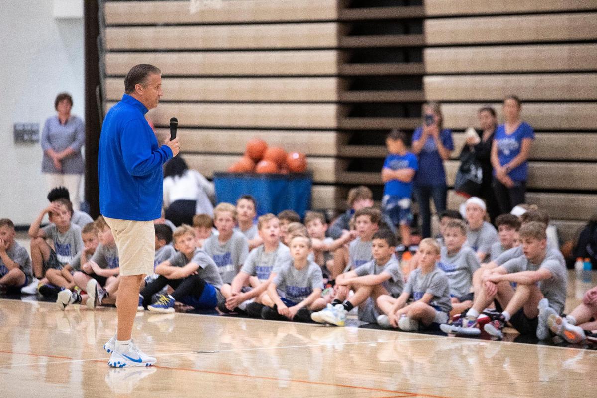 Kentucky Coach John Calipari talks with youth basketball camp participants at Ryle High School on Wednesday.