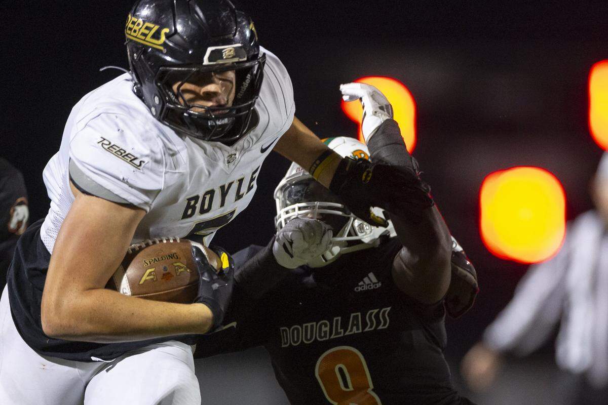 Boyle County's Seneca Driver (5) runs the ball during a game at Frederick Douglass High School in Lexington, Ky., on Friday, Oct. 31, 2025.