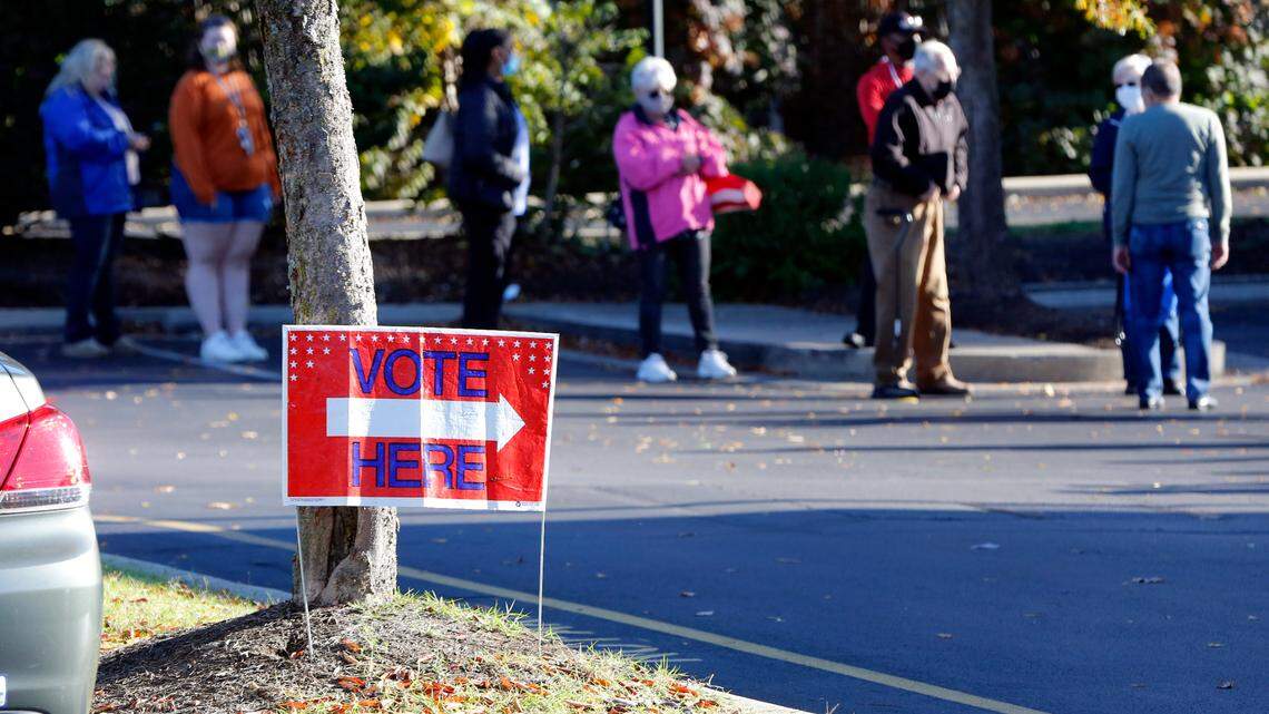 Voters wait in line to vote Tuesday, Oct. 13, 2020 at the Tates Creek library on the first day of early voting for the 2020 election in Fayette County. 