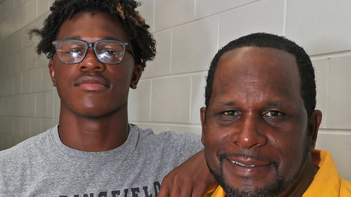 Safety Moses Douglass. left, is the most highly ranked recruit currently committed to Kentucky in its 2019 class. His father and high school head coach, Maurice Douglass, right, was a starting cornerback on UK’s 1984 Hall of Fame Bowl championship team and went on to play 11 years in the NFL.