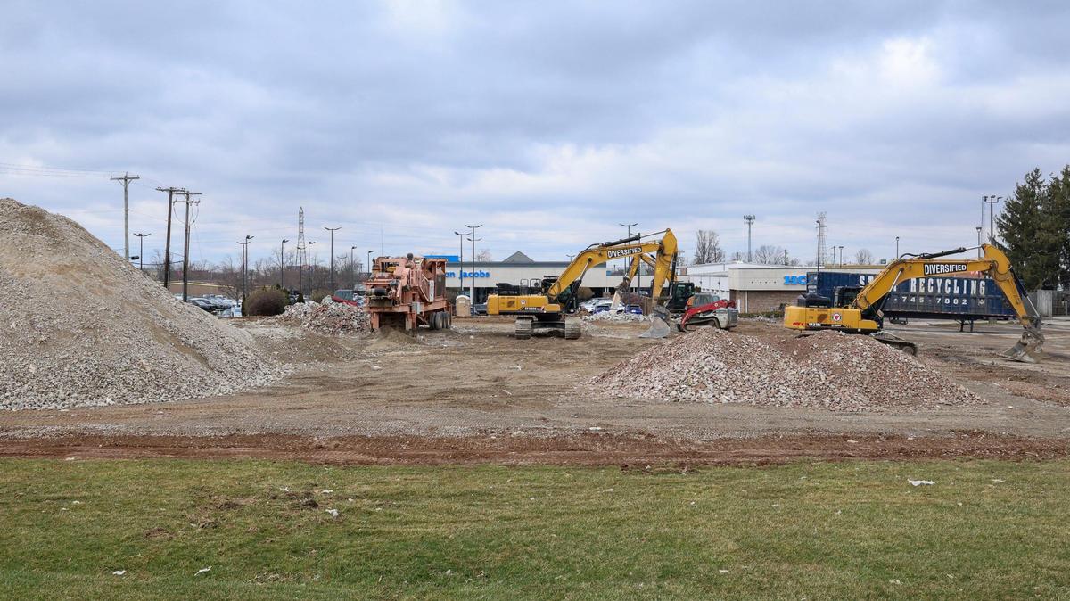 Crews with Diversified Demolition work demolishing the former Cumulus Radio building at the intersection of Nicholasville and New Circle roads, Thursday, March 6, 2025 in Lexington, Ky.