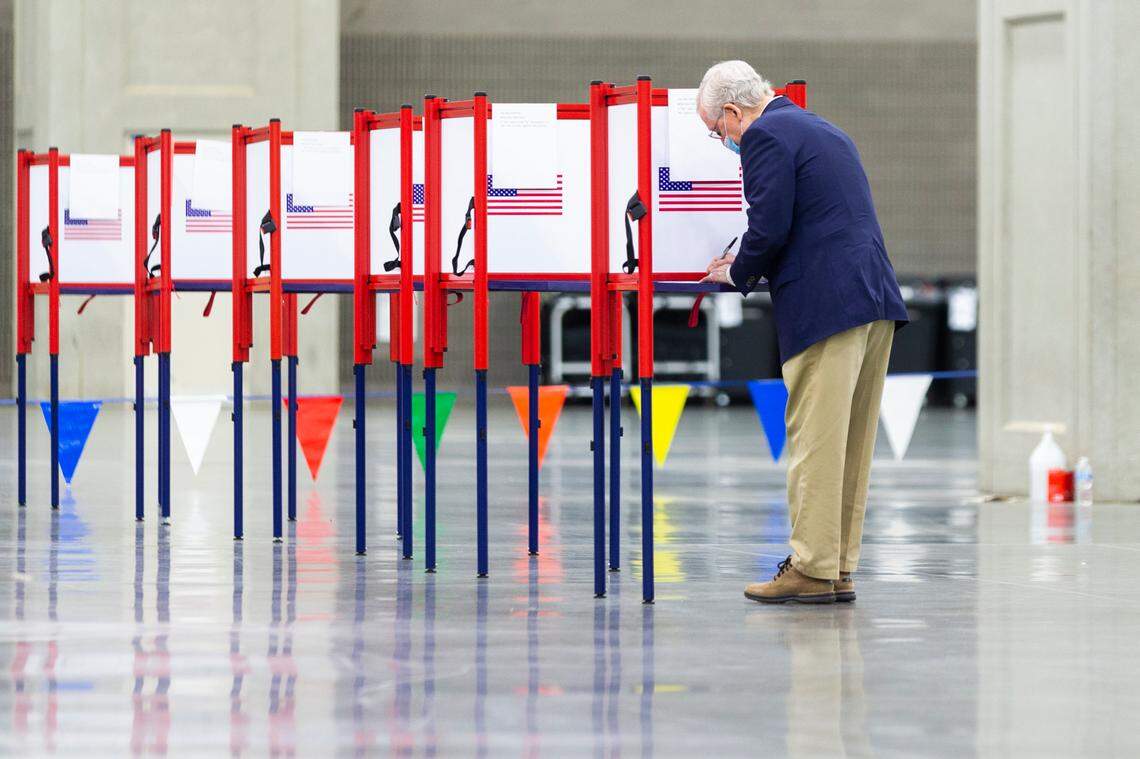 Senate Majority Leader Mitch McConnell fills out his ballot during early voting at the Kentucky Exposition Center in Louisville, Ky., Thursday, October 15, 2020.