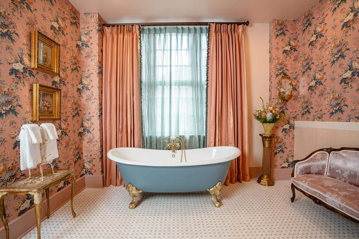 The Bridal King Suite at The Aldenberg Hotel in Versailles, Ky. Includes a clawfoot tub, a shower and room for the bride and others to get ready for the big day.
