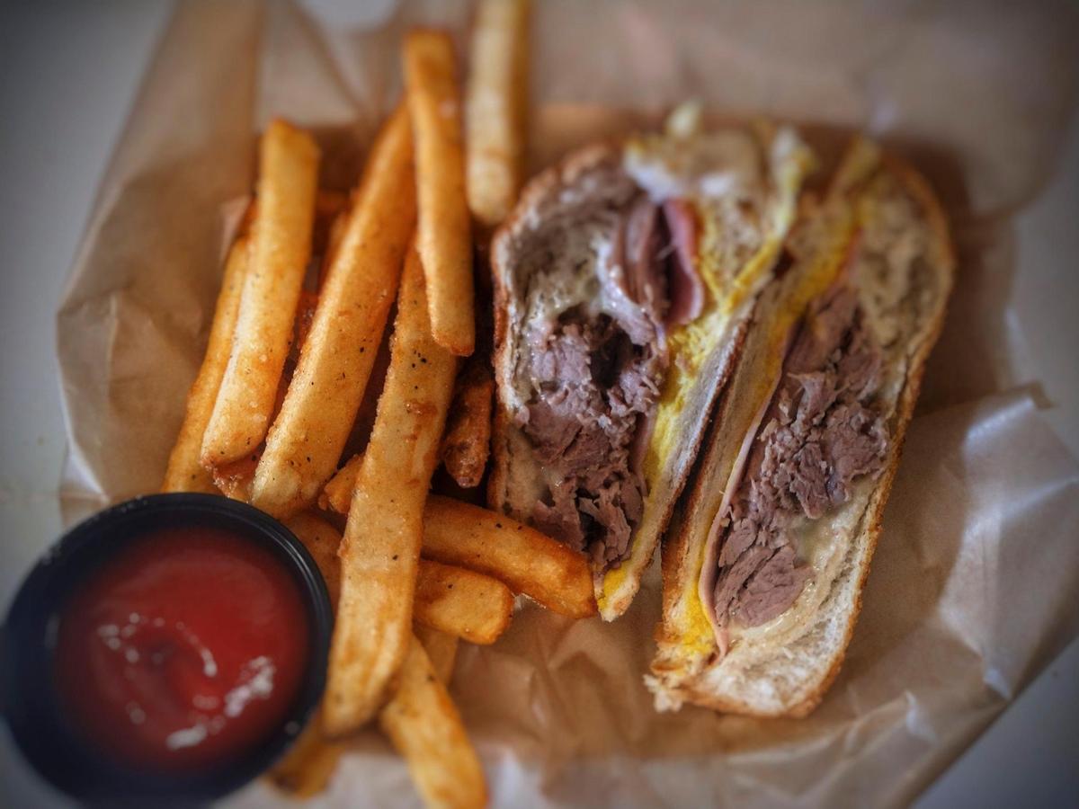 The IP&J Cuban sandwich is one of the chef’s specialties. It’s made with slow-roasted seasoned pork.