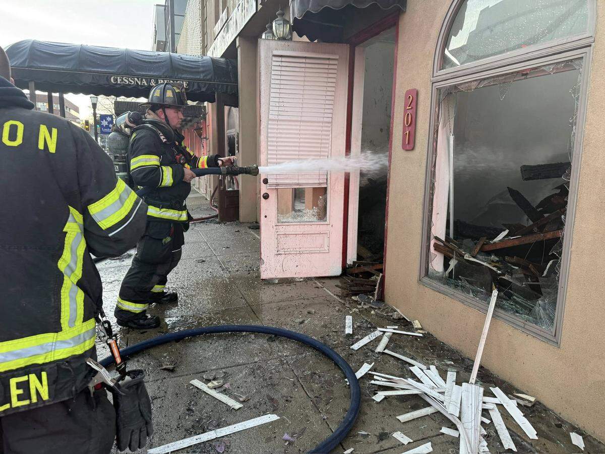 Firefighters extinguish a fire at the Cunnagin & Cunnagin law office on Main Street in downtown London, Ky., Jan. 13, 2026.