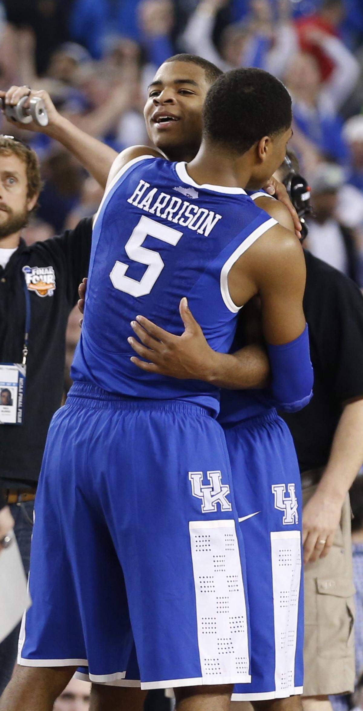 Andrew Harrison (5) hugged his brother Aaron after Kentucky defeated Wisconsin in the 2014 Final Four.