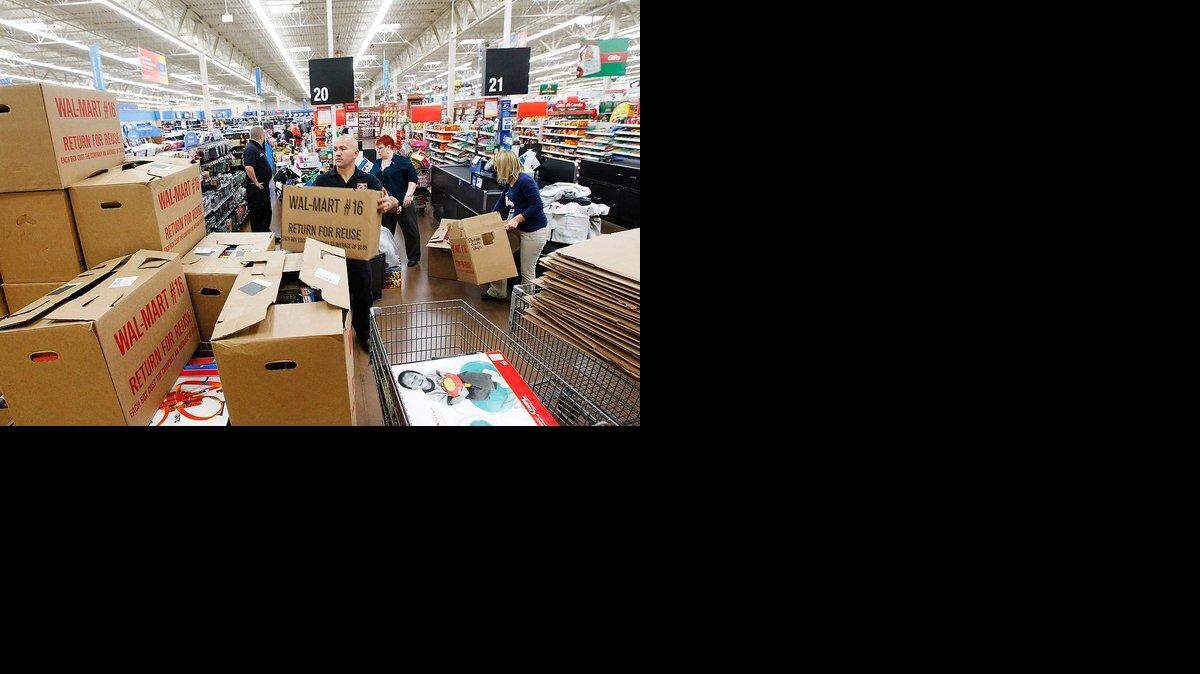 In this 2011 file photo, firefighter John Durr added boxes of toys to a wall-sized pile at Hamburg Wal-Mart in Lexington after Big Ass Fans employees shopped for thousands in gifts for the firefighters to distribute.   