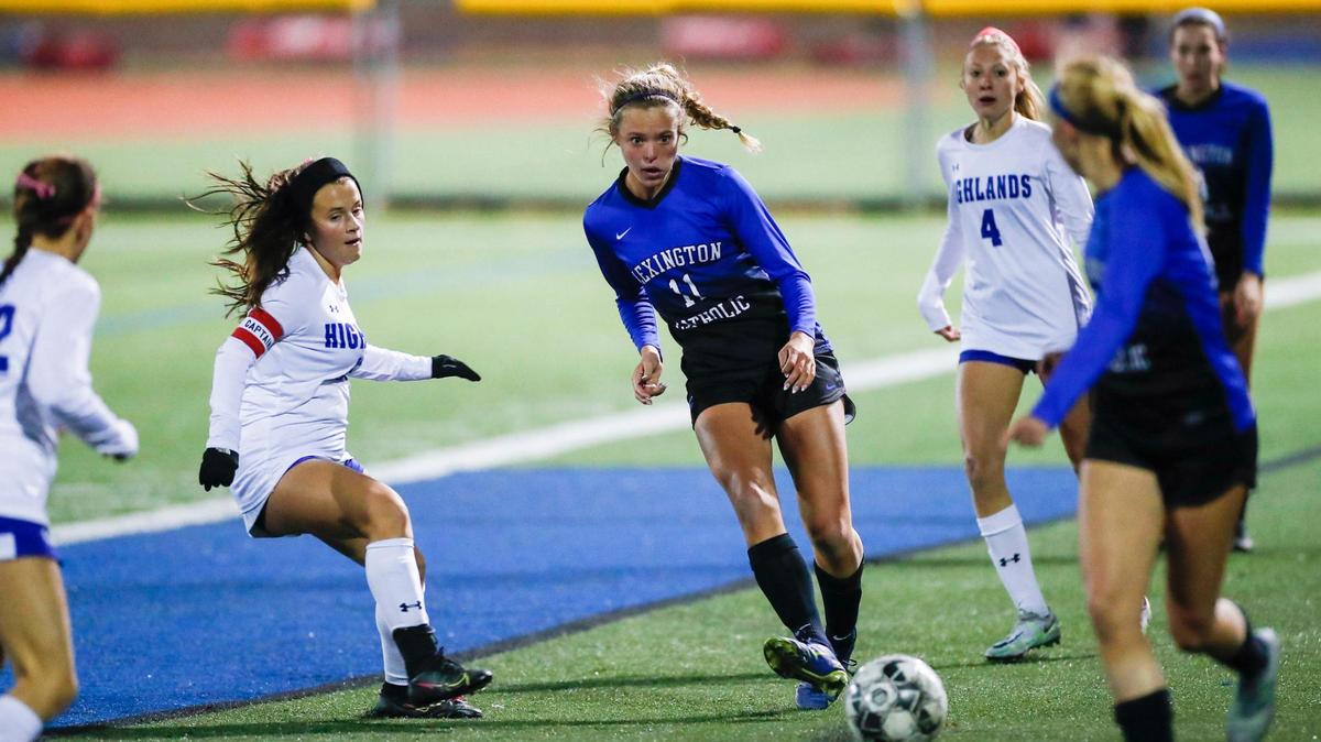 Lexington Catholic’s Katherine Truitt (11) passes to a teammate during a first-round game of the KHSAA Girls’ State Soccer Tournament against Highlands on Oct. 17.
