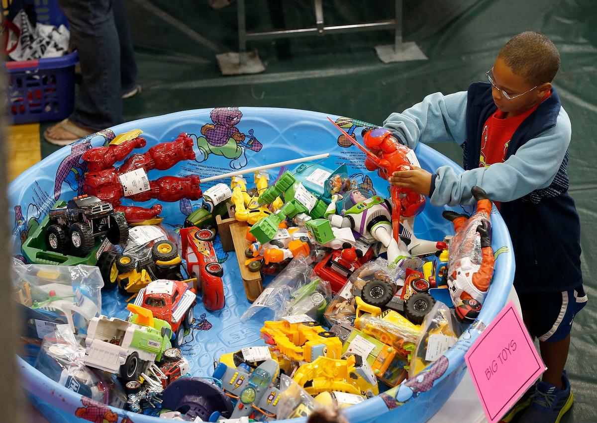 Sadiq El-Amin, 9-years-old, looked at a Bay Max toy as his mom shopped Friday morning during the opening day of the Lil’ Lambs Closet consignment sale held at Centenary United Methodist Church, 2800 Tates Creek Road. This is the 25th anniversary of the sale.