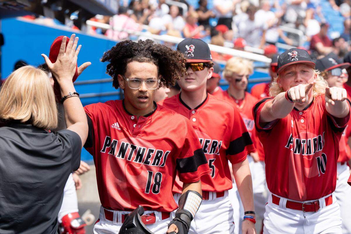 Pleasure Ridge Park's Ravon Lee (18) celebrates his run during their game against Trinity on Friday, June 14, 2024 in Lexington, Ky. at Kentucky Proud Park for the state baseball semifinals.