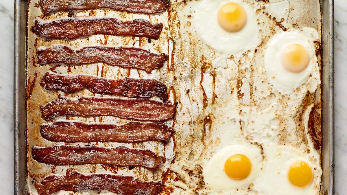 Crispy oven bacon and eggs, in Los Angeles, on Dec. 13, 2020. A big holiday breakfast is great — unless you’re the one stuck making it. This sheet-pan recipe is the solution. Food Stylist: Carrie Purcell. (Andrew Purcell/The New York Times)