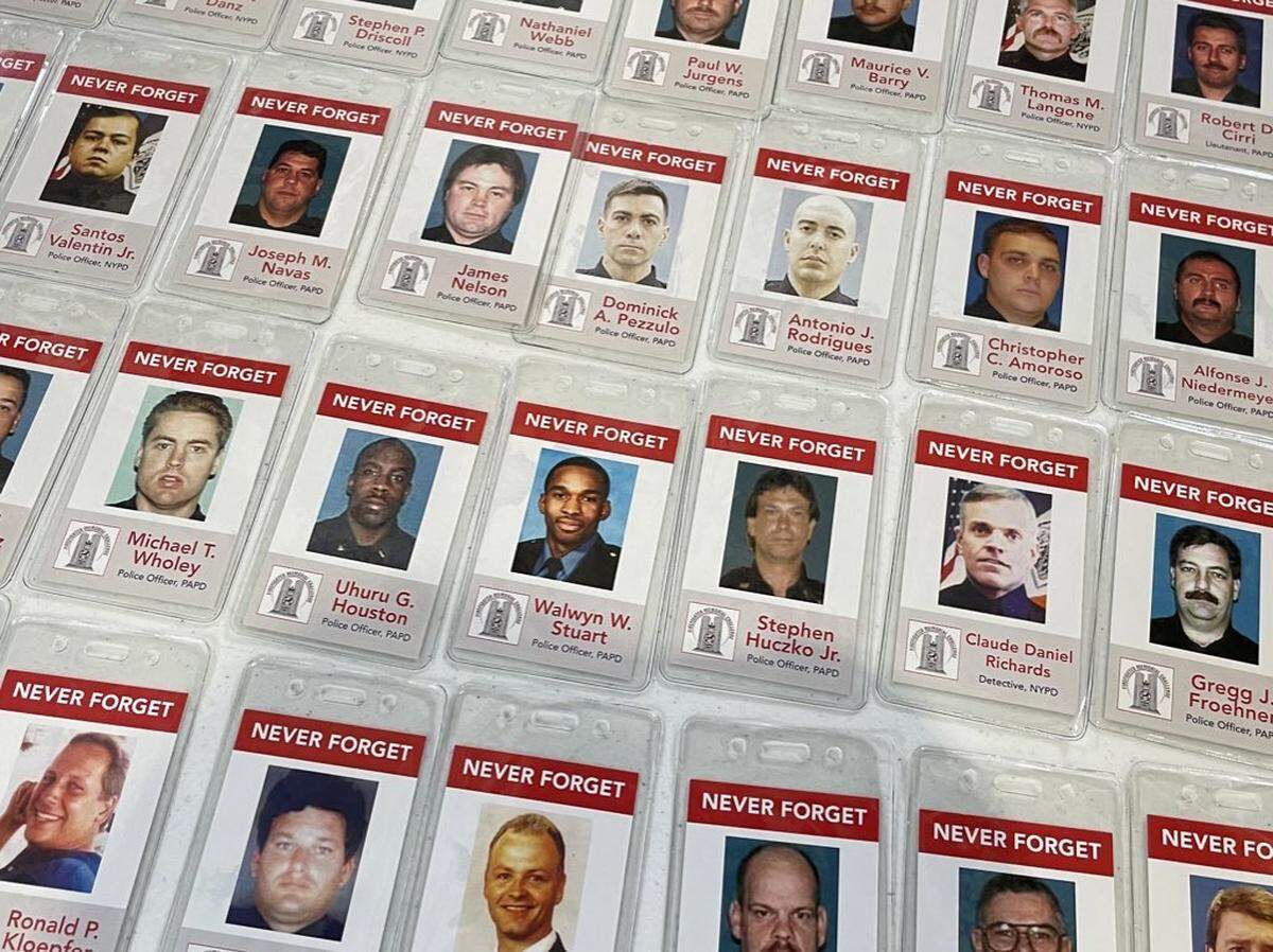 Participants wore badges with faces and names of firefighters who perished on 9/11.