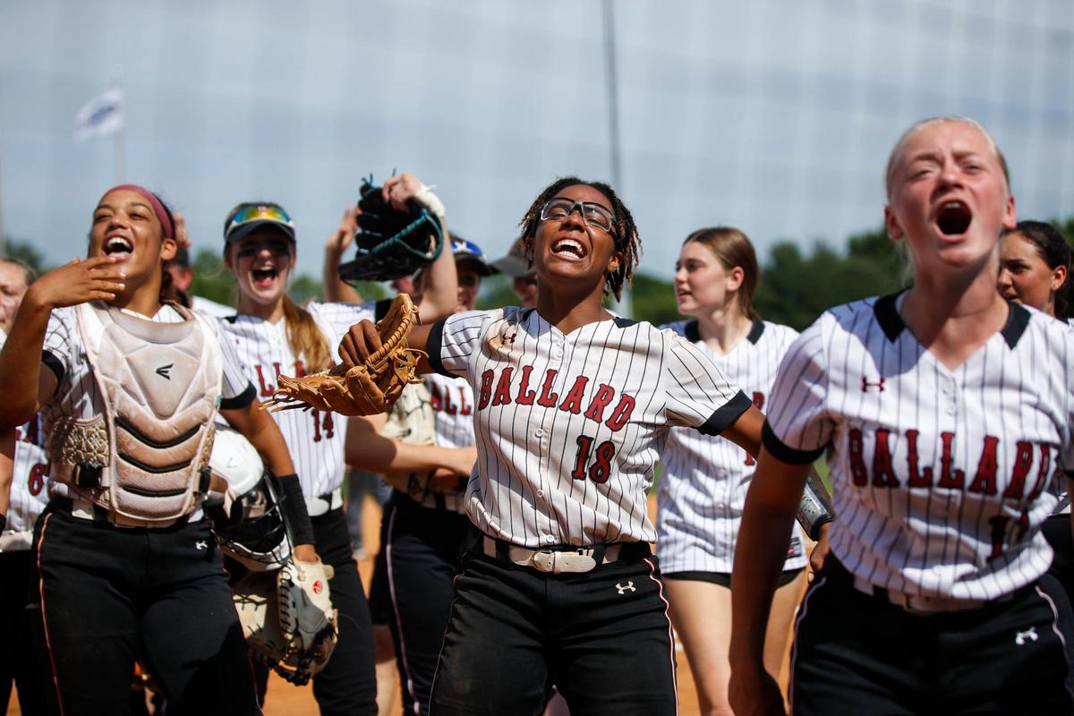 Ballard’s Imari Golden (18) celebrates turning a triple play to escape without giving up the lead to Lexington Catholic during the state softball championship game.